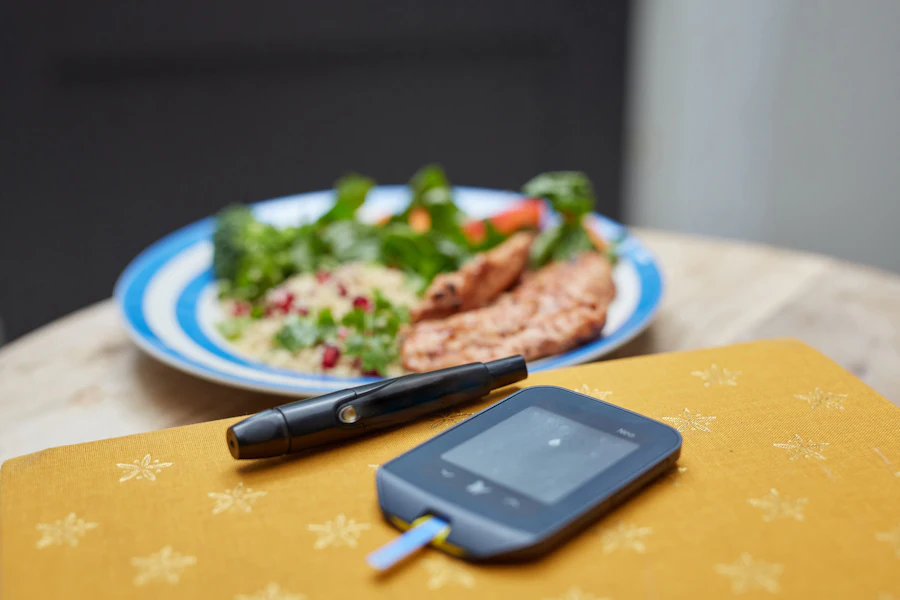 Healthy meal next to a glucometer